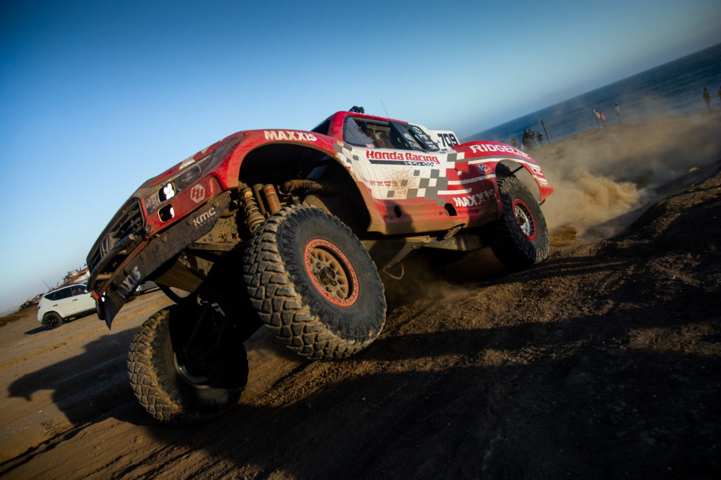 Side view of Honda Ridgeline racing in the Baja 500.