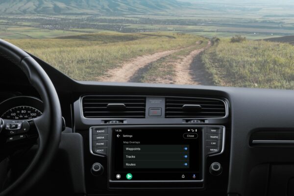 Backcountry map on Android Auto on the nav screen of a vehicle with dirt road in the distance.