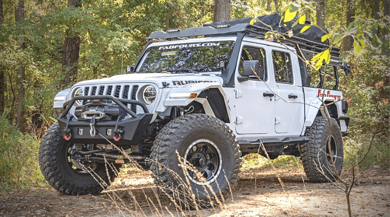 Fab Fours Jeep Gladiator parked in a clearing int he forest.