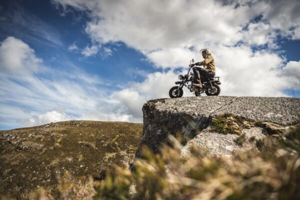 Venturo motorcycle parked at the edge of a rock