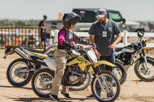 People learning to ride motorcycles at Overland Expo