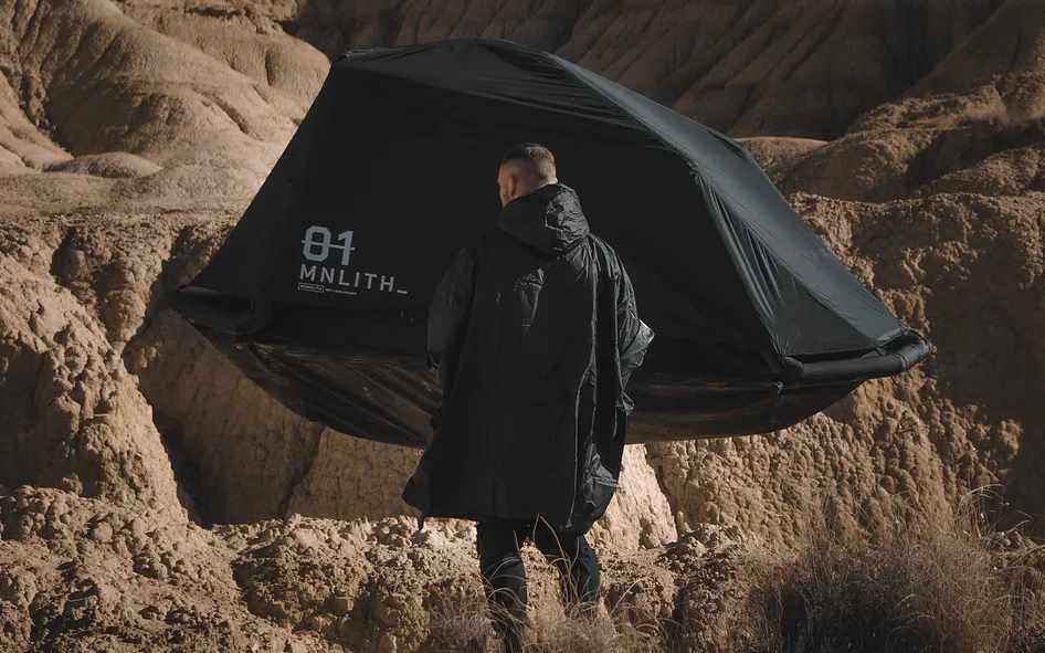 EXOD Monolith Tent floating in the desert.