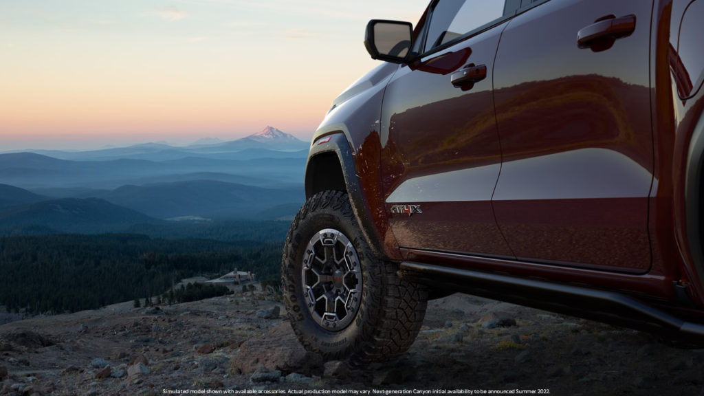GMC's next-generation Canyon AT4X's teasing badging, rocker protectors, and 17-inch wheels.