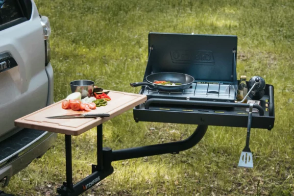 HitchFire's The Ledge is a multi-use hitch-mounted swingout to carry and store camp supplies or to use for cooking.